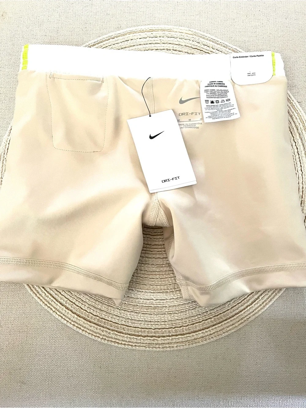 Nike Beige Sports Shorts with White Mesh Overlay and Neon Green Trim